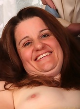 Mature gal gives you a cute smile before masturbating