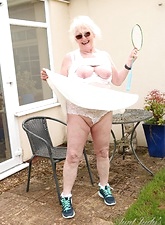 Sexy naked glasses granny showing off in her backyard