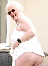 Sexy naked glasses granny showing off in her backyard