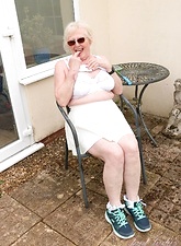 Sexy naked glasses granny showing off in her backyard